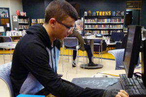 teen research A teen working on a computer