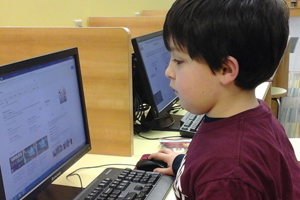 Image of child on library computer playing ABC Mouse