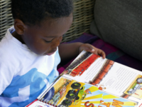 Toddler Boy Reading 2 toddler reading a book
