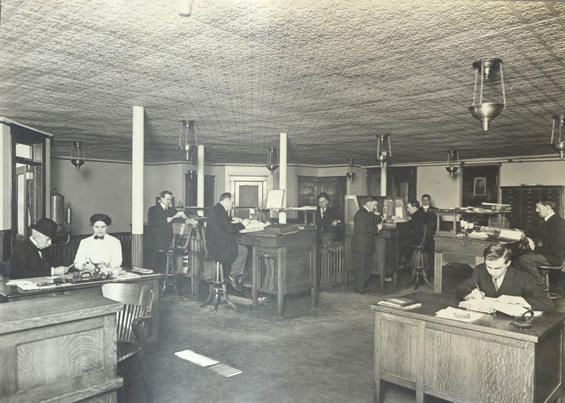 06 - Photo of the interior of the warehouse showing the clerical staff at work - LH Collections