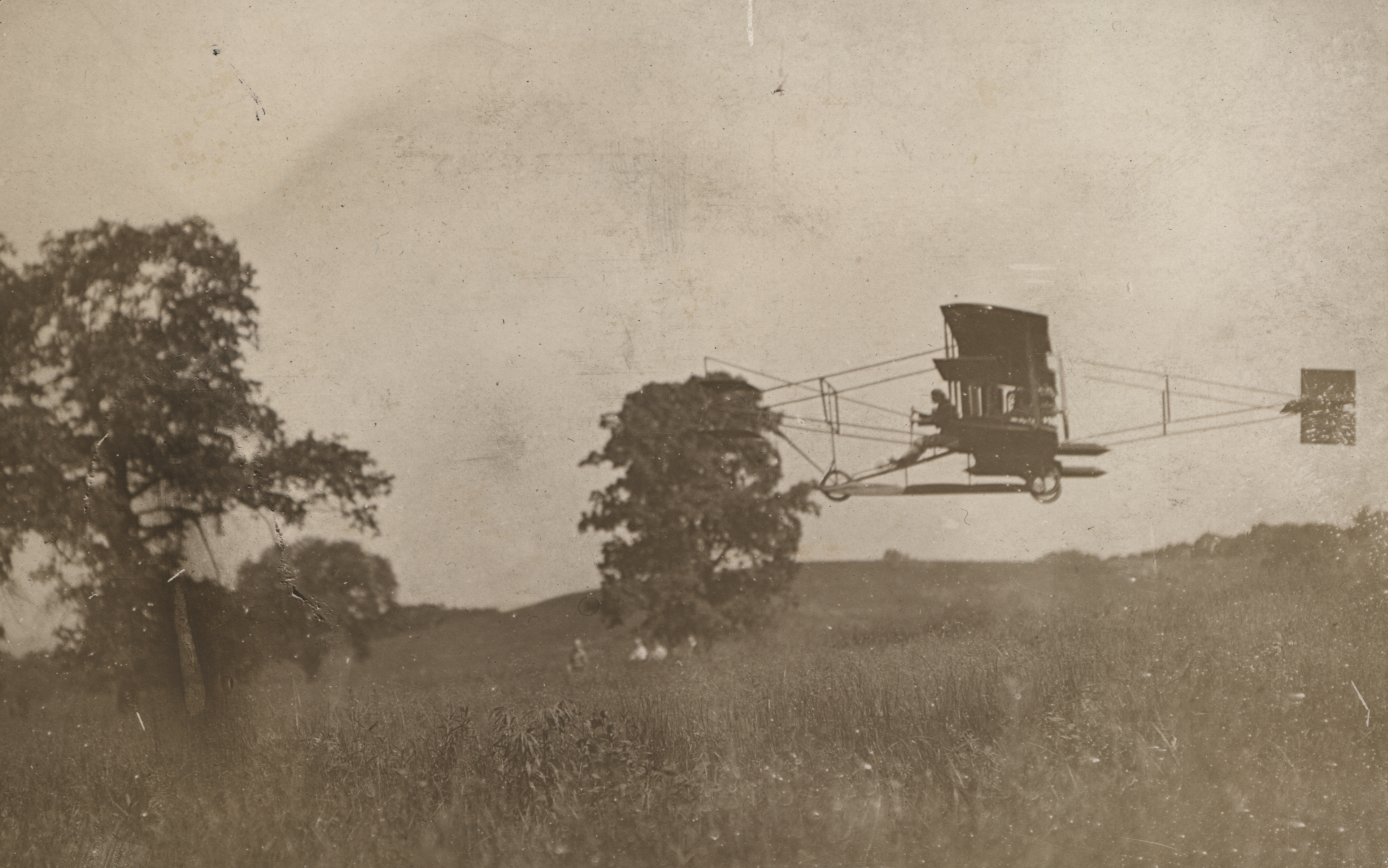 Sepia-toned photograph of Glenn Curtiss' Hudson Flier, on the ground. LH Collections.