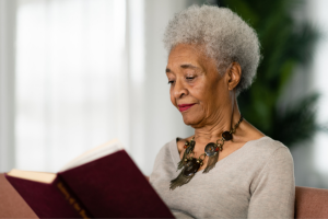 Elderly woman reading a book